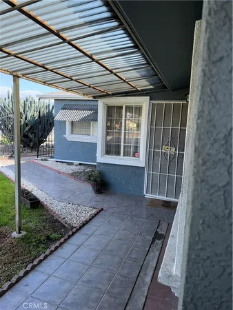 a view of house with backyard and porch