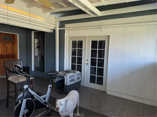 a view of a room with furniture and windows