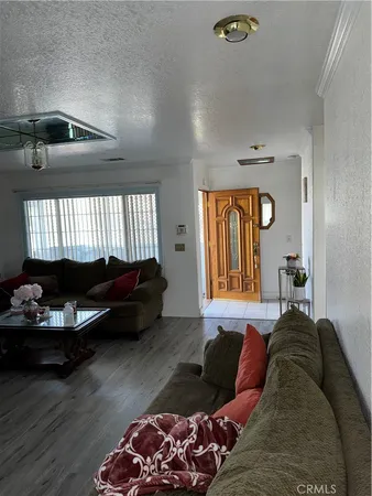 a living room with a couch and a window