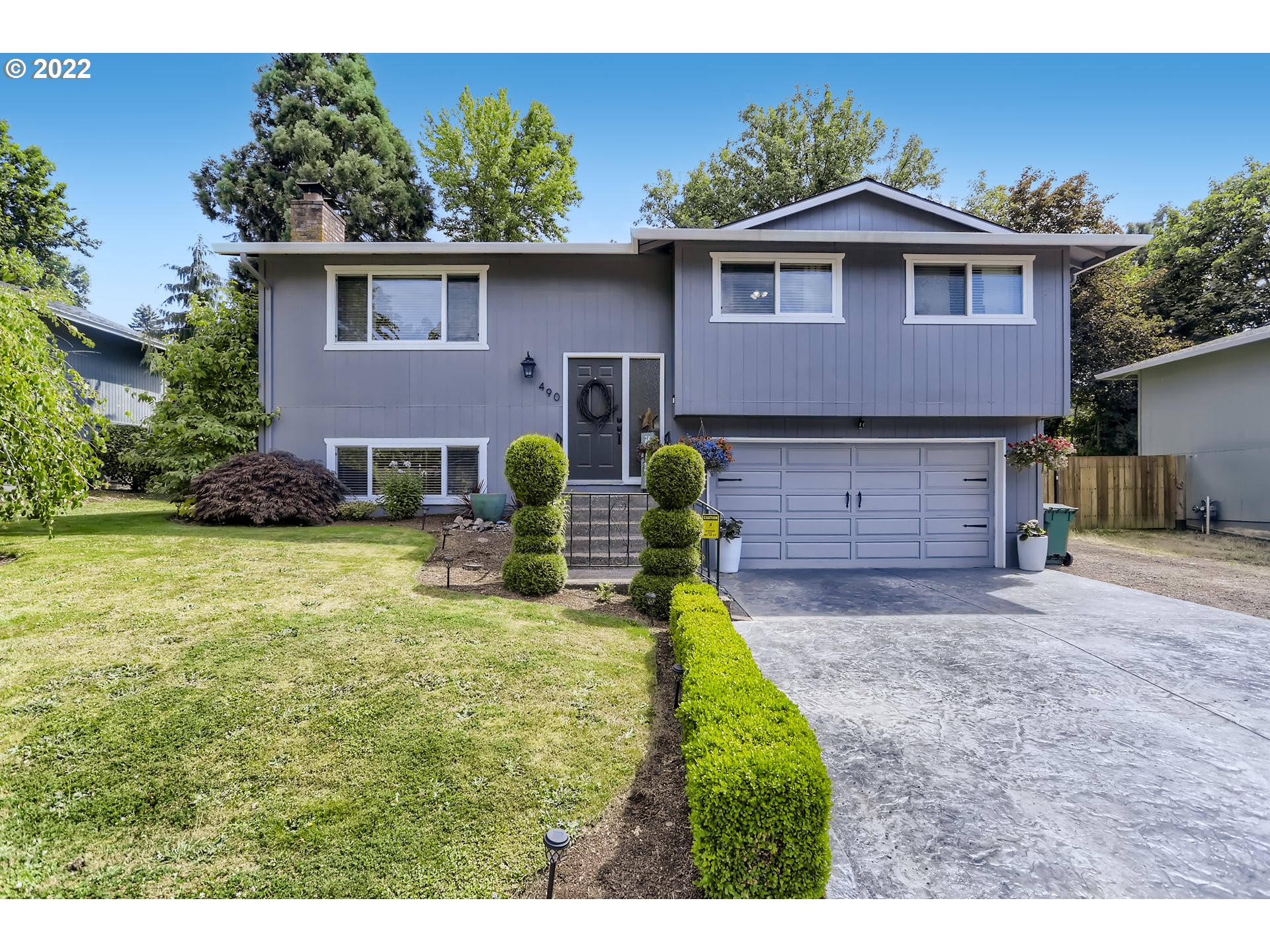 490 Southwest 4th Street Gresham, OR 97080 - Photo 1 of 30 a front view of a house with garden