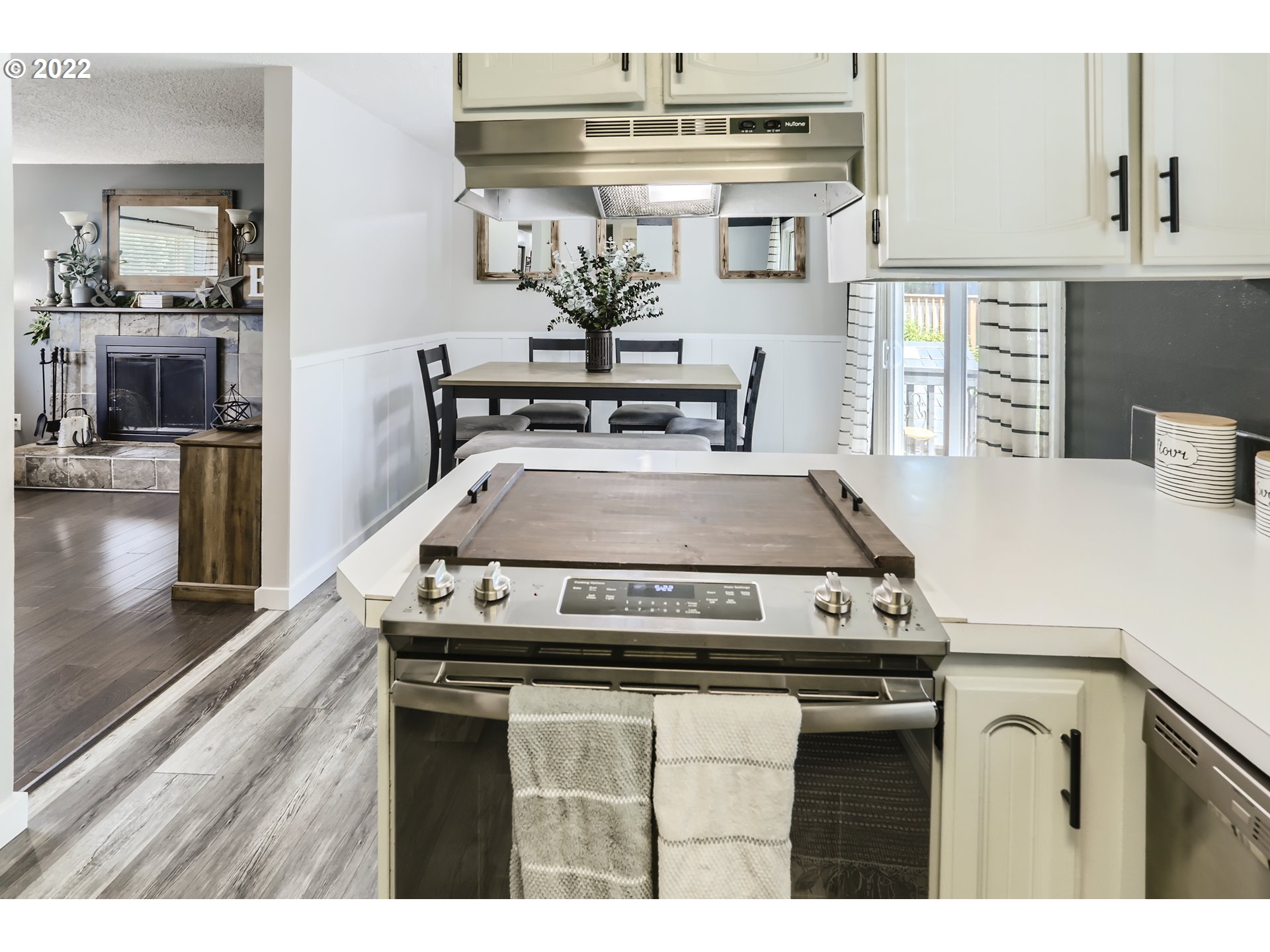 490 Southwest 4th Street Gresham, OR 97080 - Photo 14 of 30 a stove top oven sitting inside of a kitchen