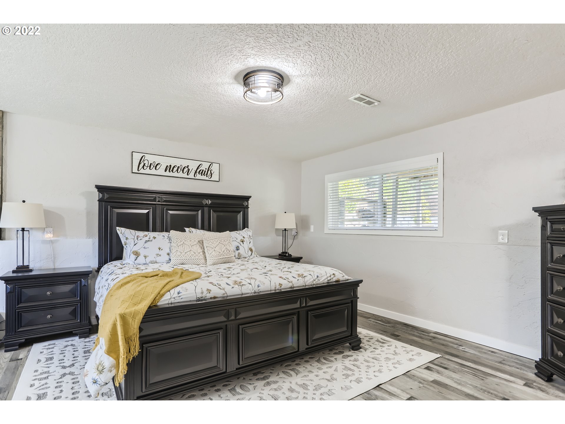 490 Southwest 4th Street Gresham, OR 97080 - Photo 15 of 30 a bedroom with a bed and a window