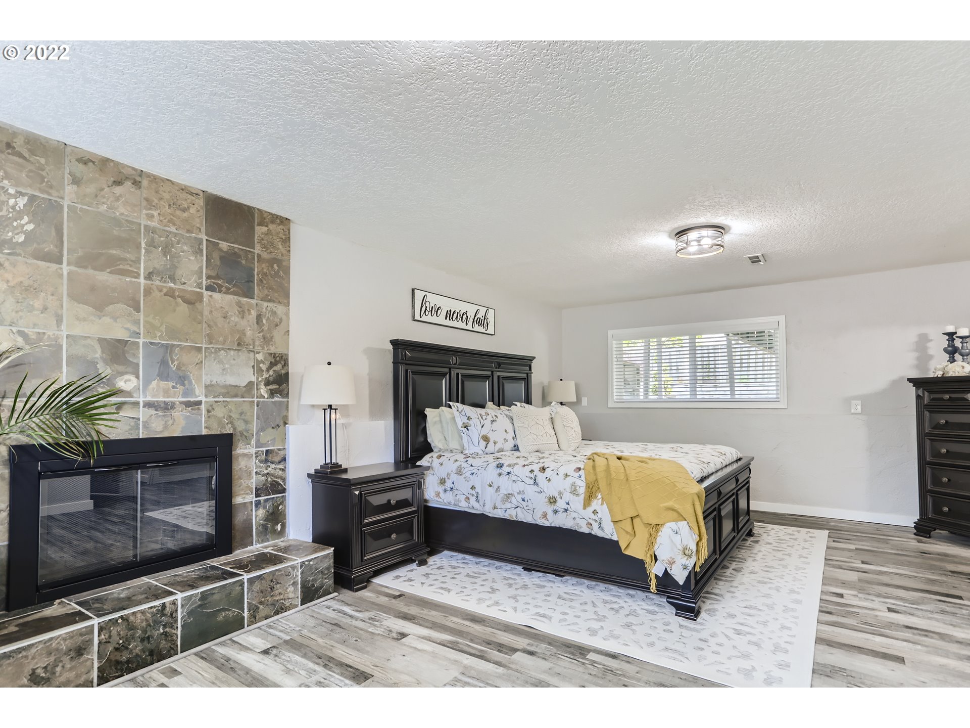 490 Southwest 4th Street Gresham, OR 97080 - Photo 16 of 30 a living room with furniture and a fireplace