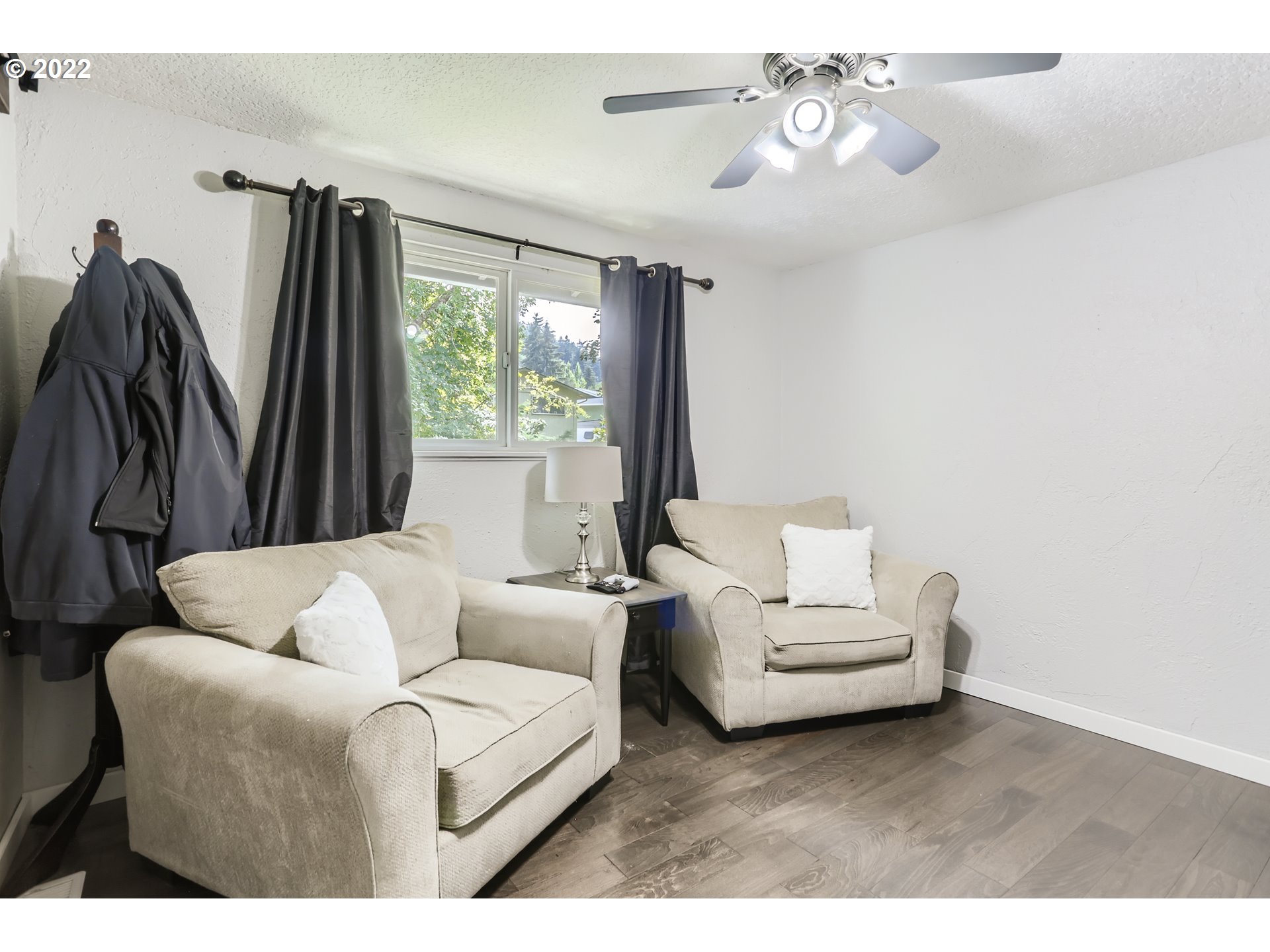 490 Southwest 4th Street Gresham, OR 97080 - Photo 20 of 30 a living room with furniture a large window and a chandelier