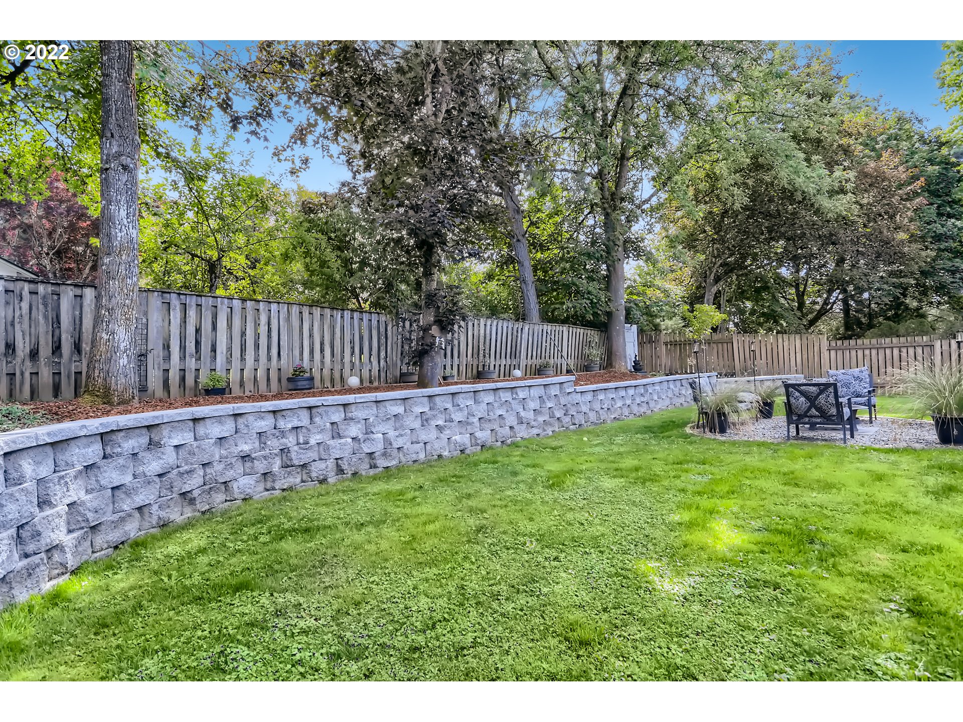 490 Southwest 4th Street Gresham, OR 97080 - Photo 27 of 30 a backyard of a house with table and chairs