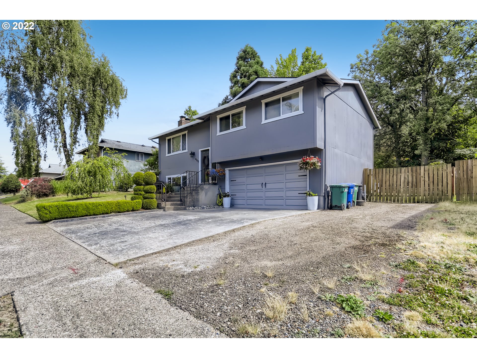 490 Southwest 4th Street Gresham, OR 97080 - Photo 3 of 30 a front view of a house with a yard and garage