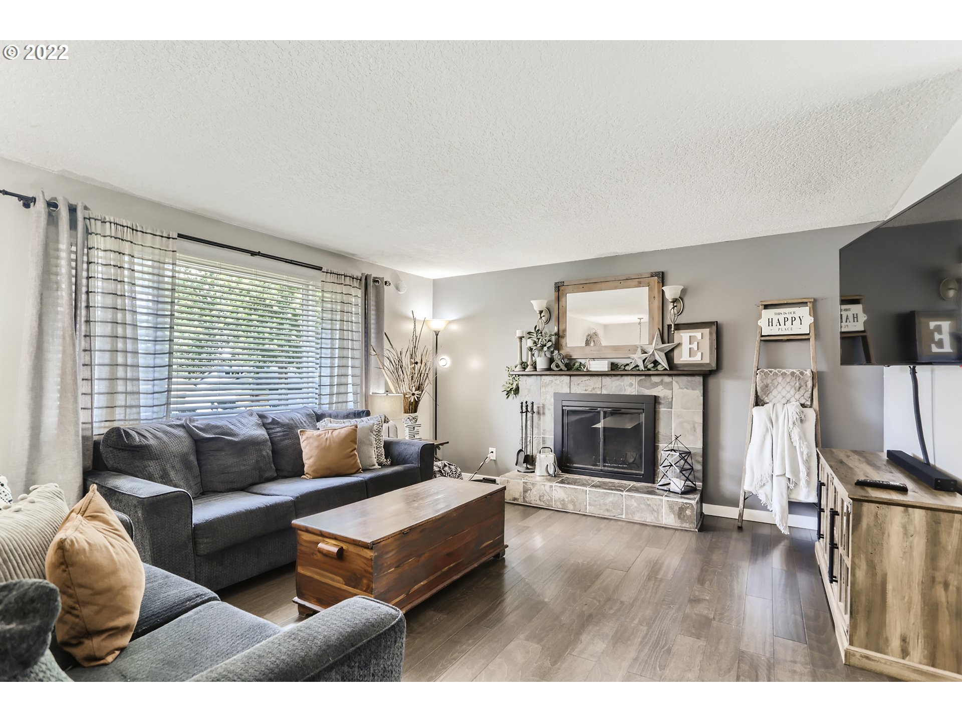 490 Southwest 4th Street Gresham, OR 97080 - Photo 6 of 30 a living room with furniture and a fireplace