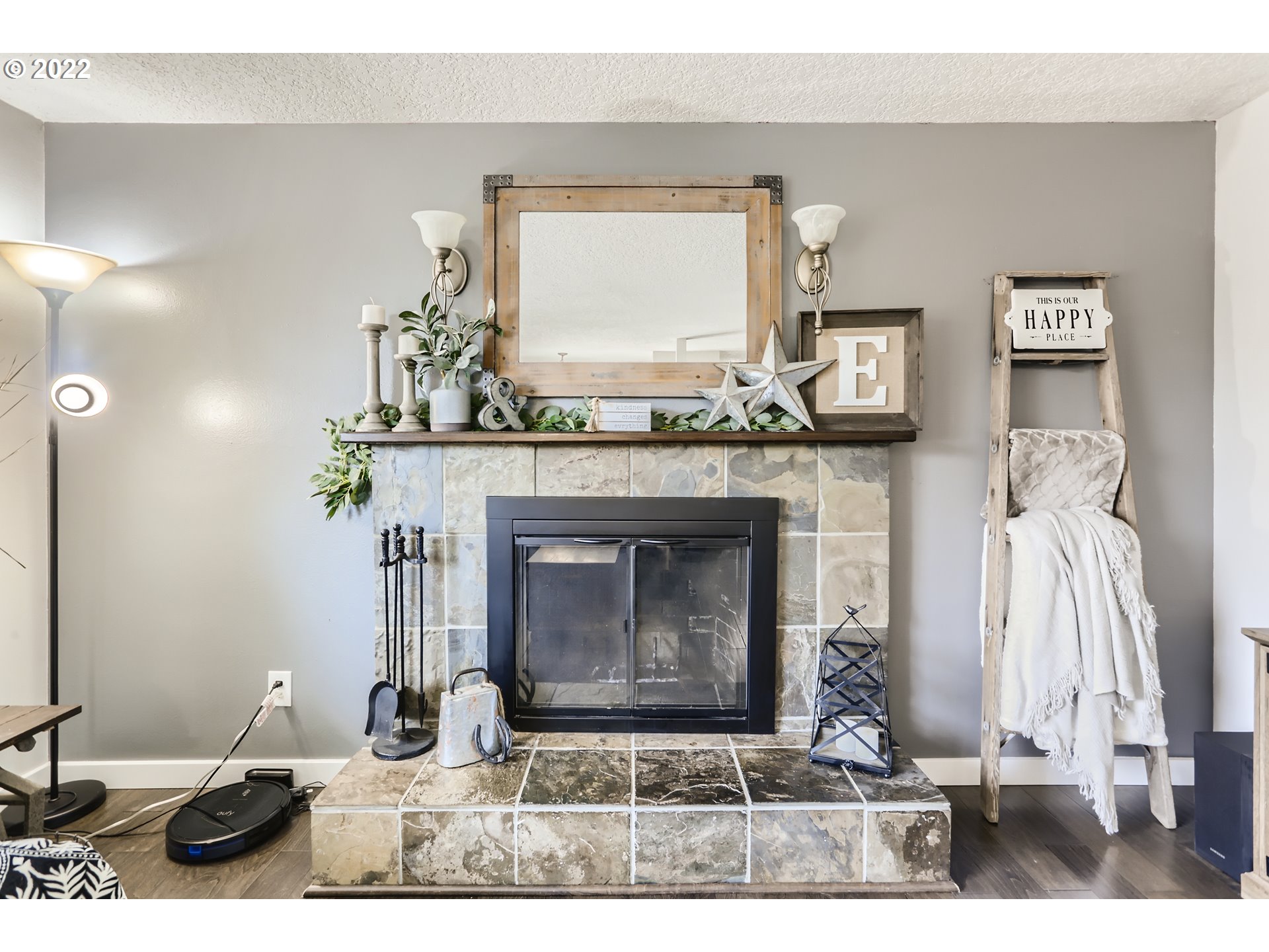 490 Southwest 4th Street Gresham, OR 97080 - Photo 8 of 30 a living room with furniture a fireplace and a flat screen tv