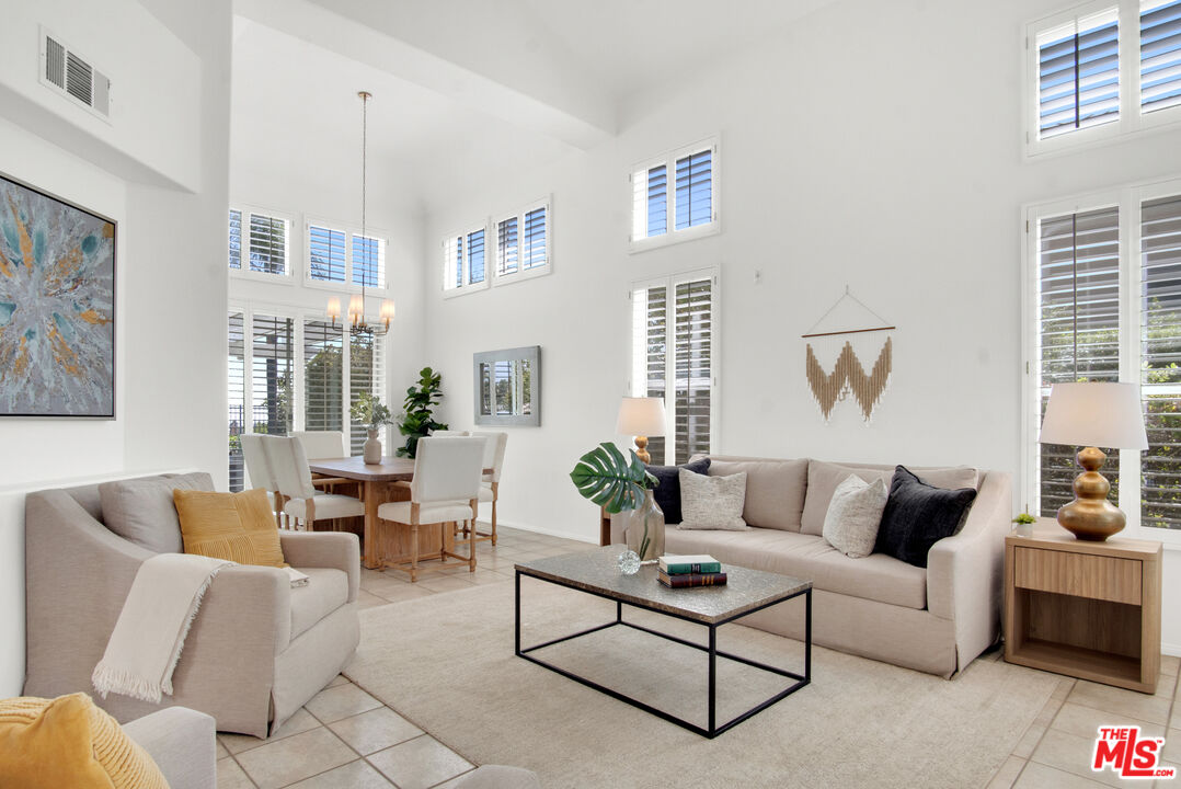 59 La Perla Foothill Ranch, CA 92610 - Photo 15 of 60 a living room with furniture and a potted plant
