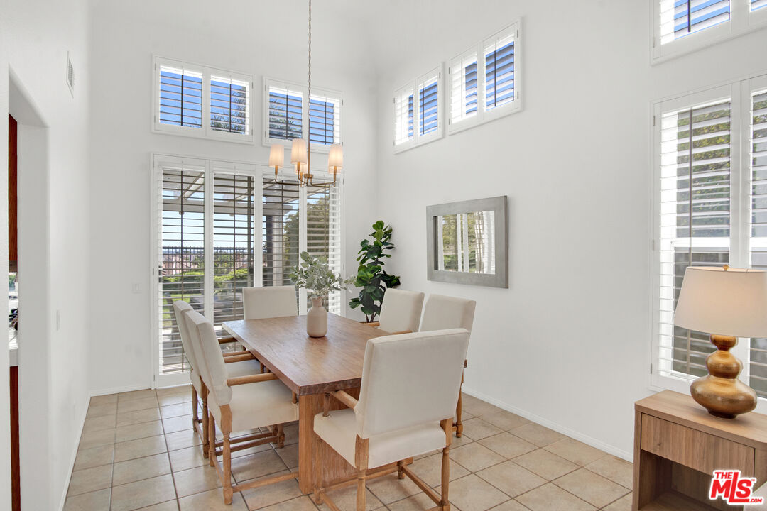 59 La Perla Foothill Ranch, CA 92610 - Photo 17 of 60 a view of a dining room with furniture window and wooden floor