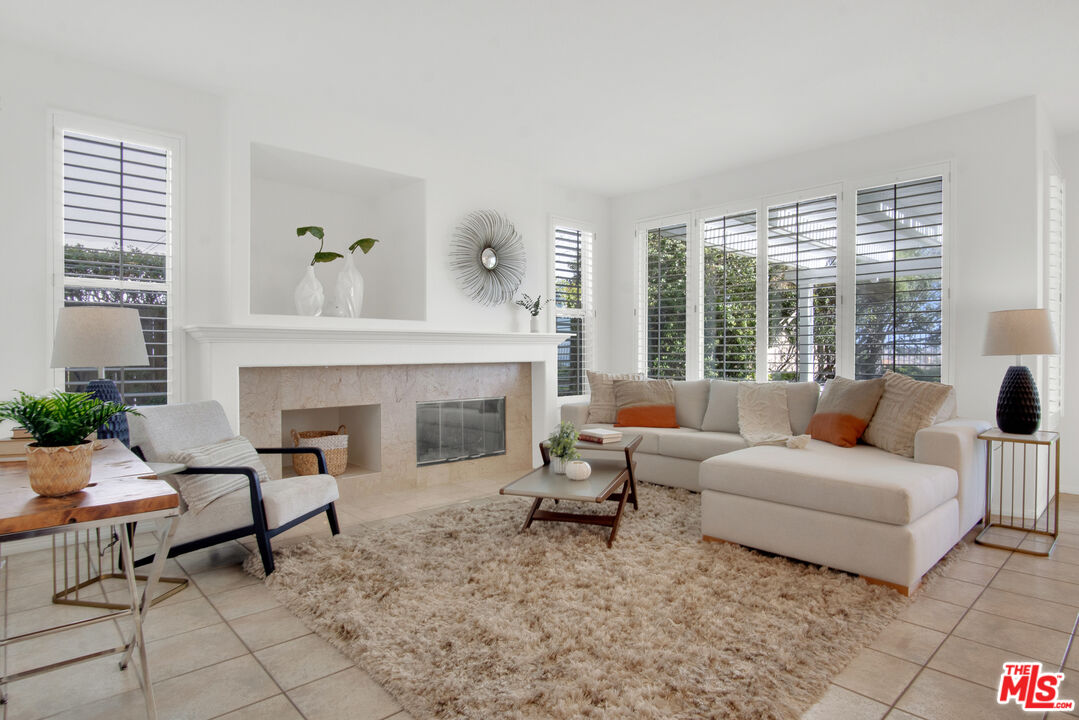 59 La Perla Foothill Ranch, CA 92610 - Photo 24 of 60 a living room with furniture and a fireplace