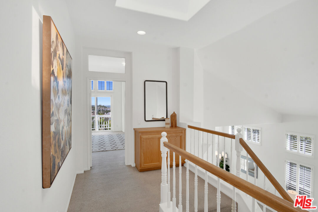 59 La Perla Foothill Ranch, CA 92610 - Photo 33 of 60 a view of a hallway with windows and stairs