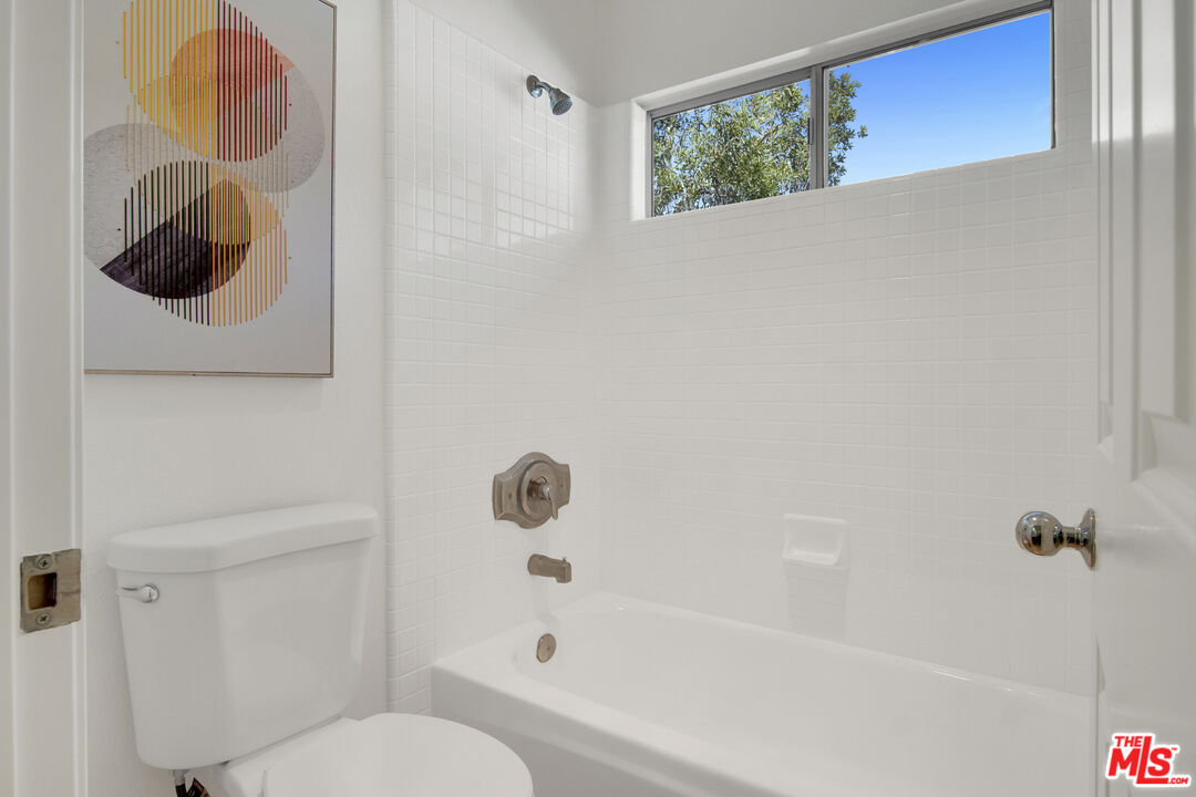 59 La Perla Foothill Ranch, CA 92610 - Photo 44 of 60 a bathroom with a toilet and a tub