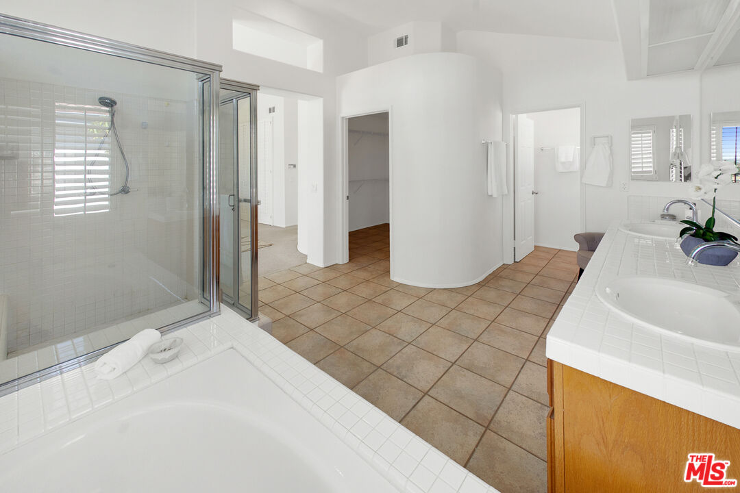 59 La Perla Foothill Ranch, CA 92610 - Photo 48 of 60 a bathroom with a sink and a mirror