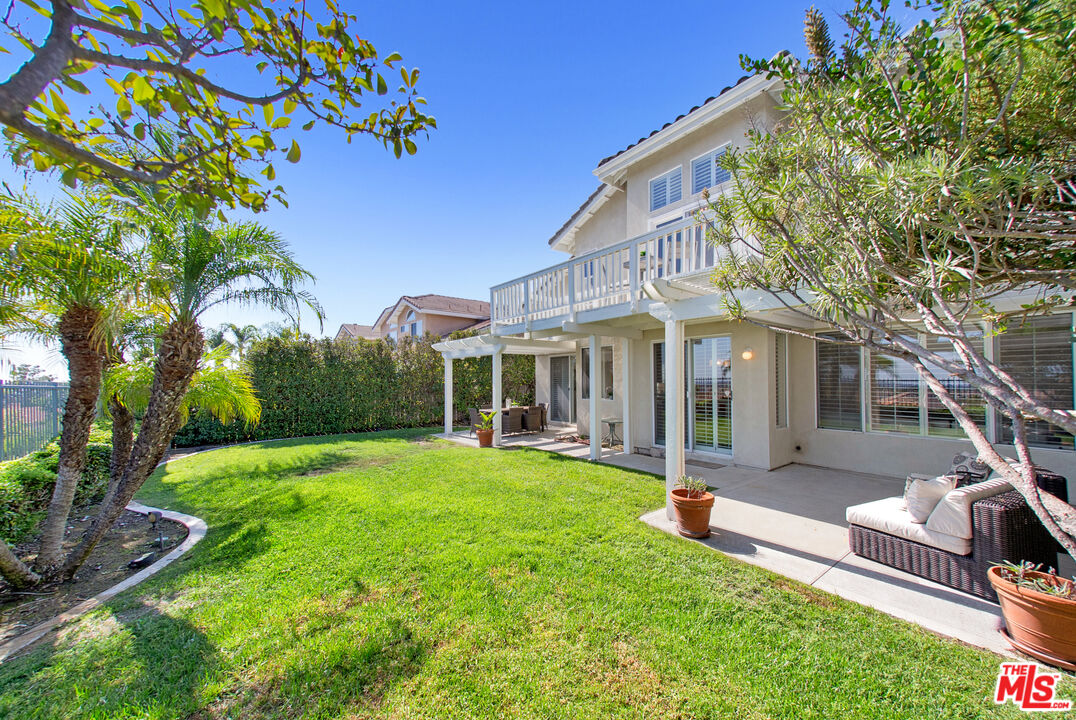59 La Perla Foothill Ranch, CA 92610 - Photo 57 of 60 a view of a house with a yard and porch