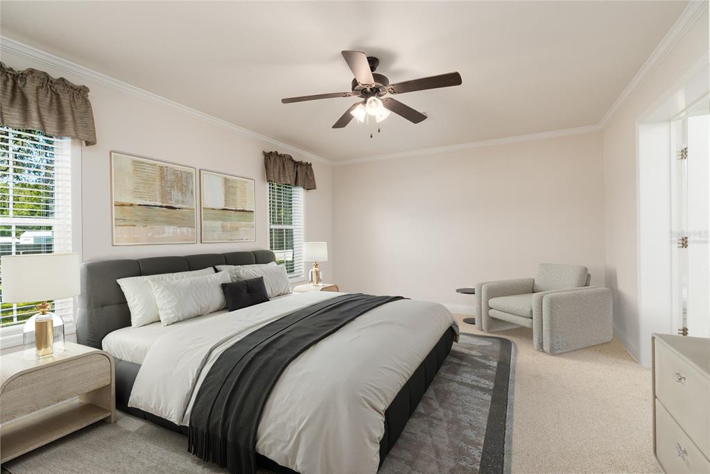 689 Eagle Watch Road Oak Hill, FL 32759 - Photo 14 of 32 a bedroom with a bed and window