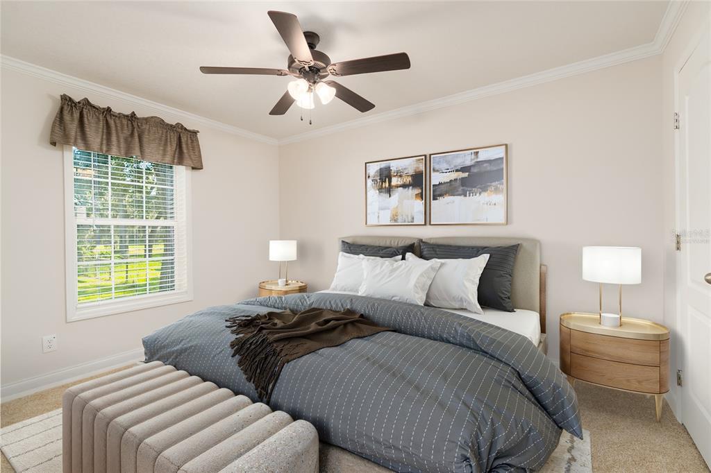 689 Eagle Watch Road Oak Hill, FL 32759 - Photo 22 of 32 a bedroom with bed and a window