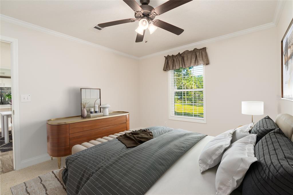 689 Eagle Watch Road Oak Hill, FL 32759 - Photo 23 of 32 a bedroom with a bed and window