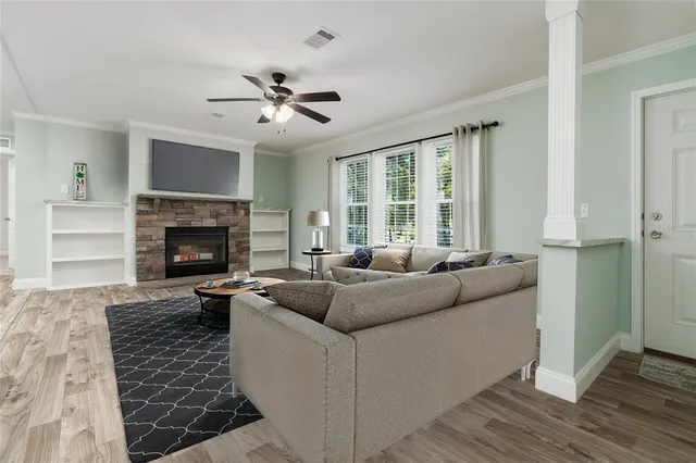 a living room with furniture and a fireplace
