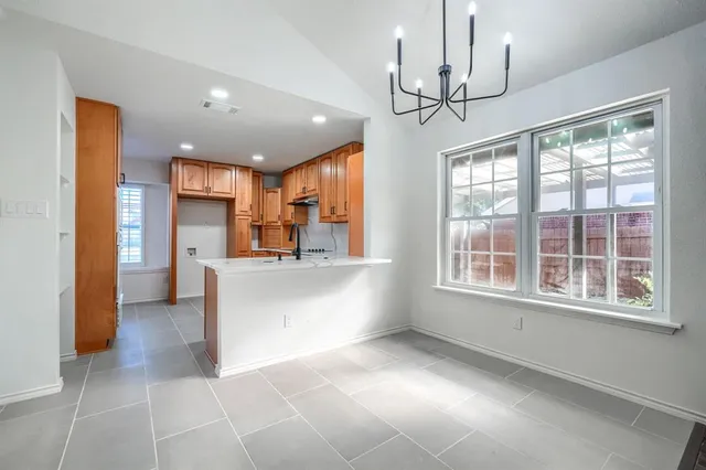 a view of a kitchen with a sink and a window