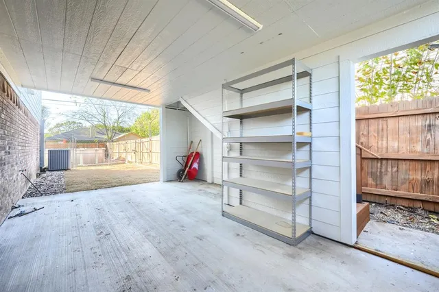 a view of a big room with wooden floor and windows in a room