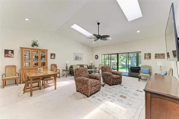 a large kitchen with a table and chairs in it