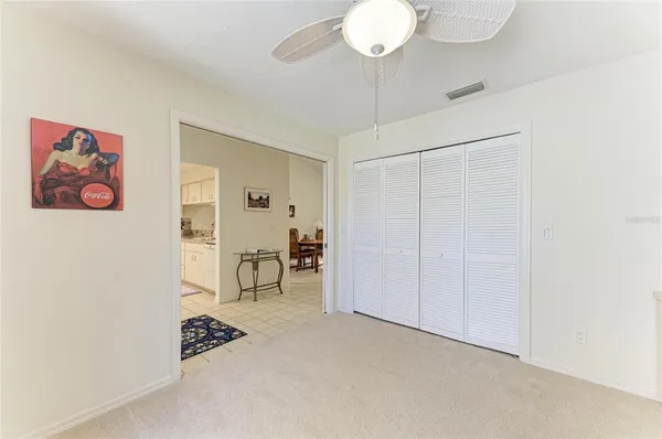 a view of a room with a large window and table