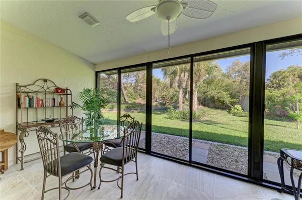 a view of a house with a yard porch and sitting area