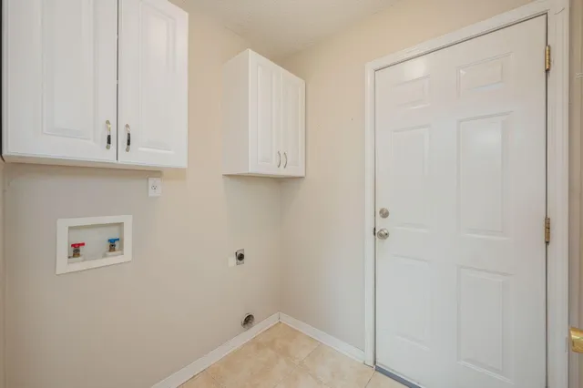 a bathroom with a sink and cabinets