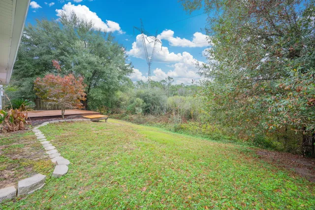 a backyard of a house with lots of green space