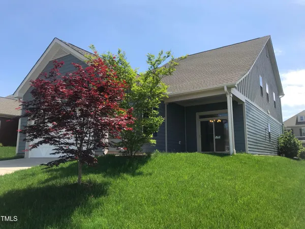 a view of a house with a garden