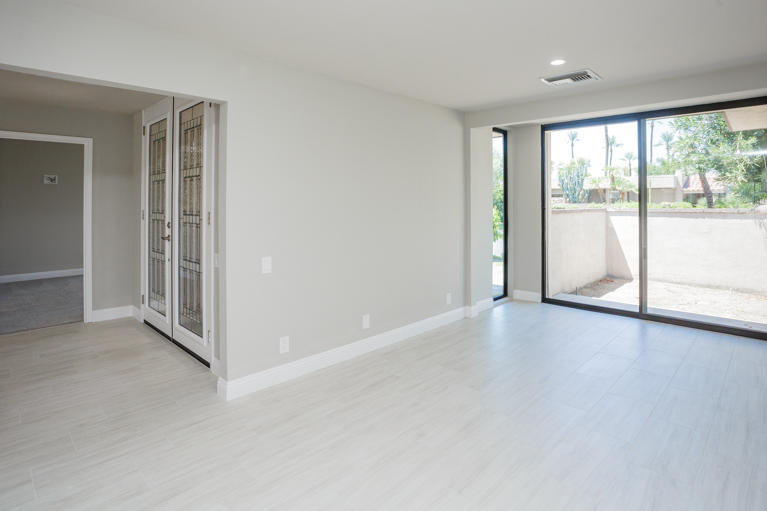 49 Columbia Drive Rancho Mirage, CA 92270 - Photo 13 of 52 an empty room with windows and view