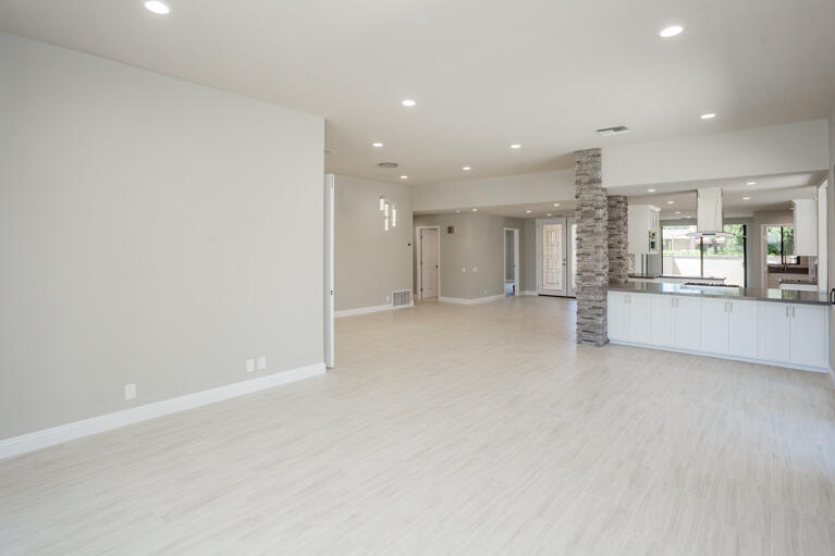 49 Columbia Drive Rancho Mirage, CA 92270 - Photo 15 of 52 an empty room with white walls and windows