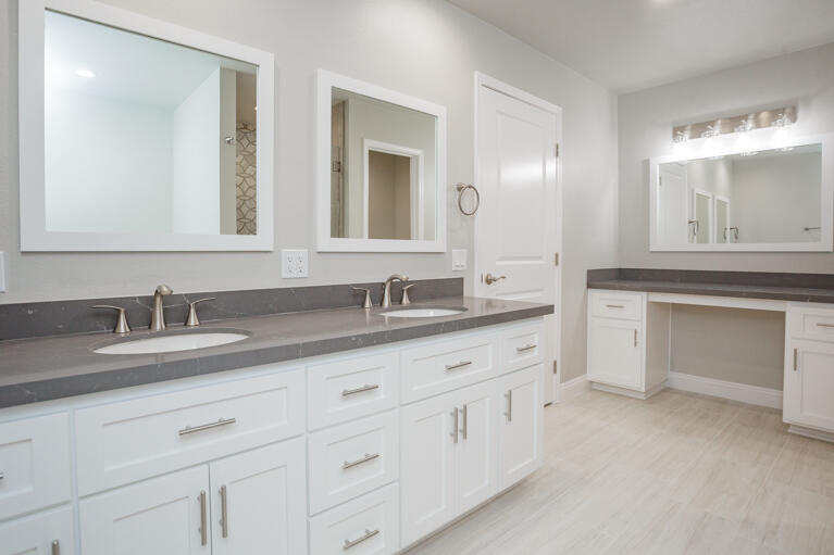 49 Columbia Drive Rancho Mirage, CA 92270 - Photo 22 of 52 a bathroom with double sink and a mirror