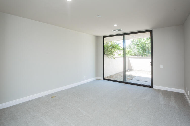49 Columbia Drive Rancho Mirage, CA 92270 - Photo 25 of 52 an empty room with large windows