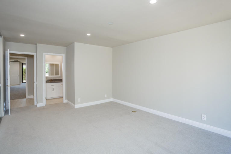 49 Columbia Drive Rancho Mirage, CA 92270 - Photo 26 of 52 wooden floor in an empty room and a kitchen