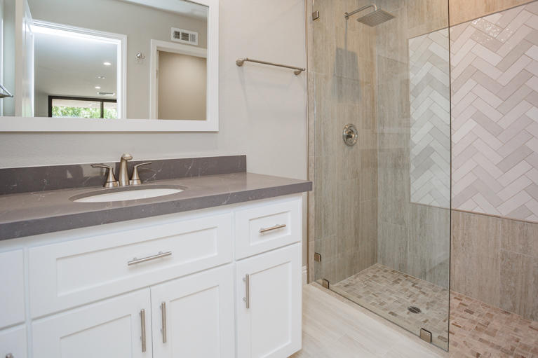 49 Columbia Drive Rancho Mirage, CA 92270 - Photo 27 of 52 a bathroom with a sink and a mirror
