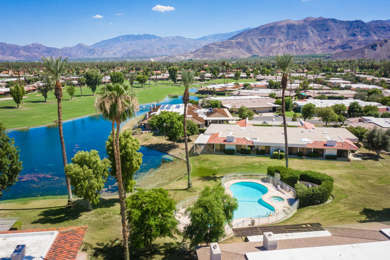 49 Columbia Drive Rancho Mirage, CA 92270 - Photo 4 of 52 a view of a town with mountains in the background