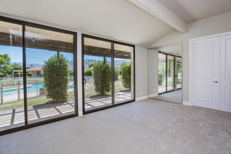 49 Columbia Drive Rancho Mirage, CA 92270 - Photo 31 of 52 a view of an empty room with windows and balcony