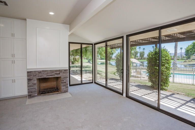 49 Columbia Drive Rancho Mirage, CA 92270 - Photo 33 of 52 a view of an empty room with window and fire place