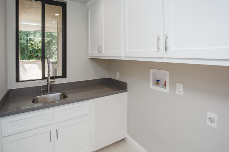 49 Columbia Drive Rancho Mirage, CA 92270 - Photo 34 of 52 a kitchen with granite countertop white cabinets and a sink