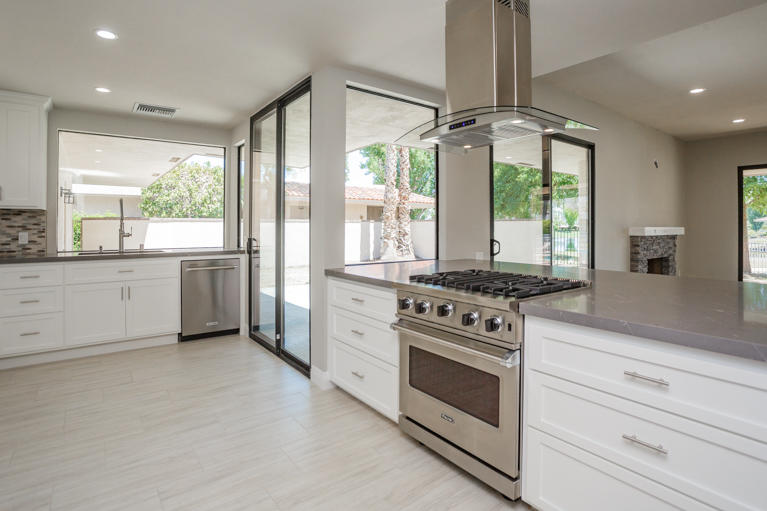 49 Columbia Drive Rancho Mirage, CA 92270 - Photo 5 of 52 a kitchen with a stove oven and sink