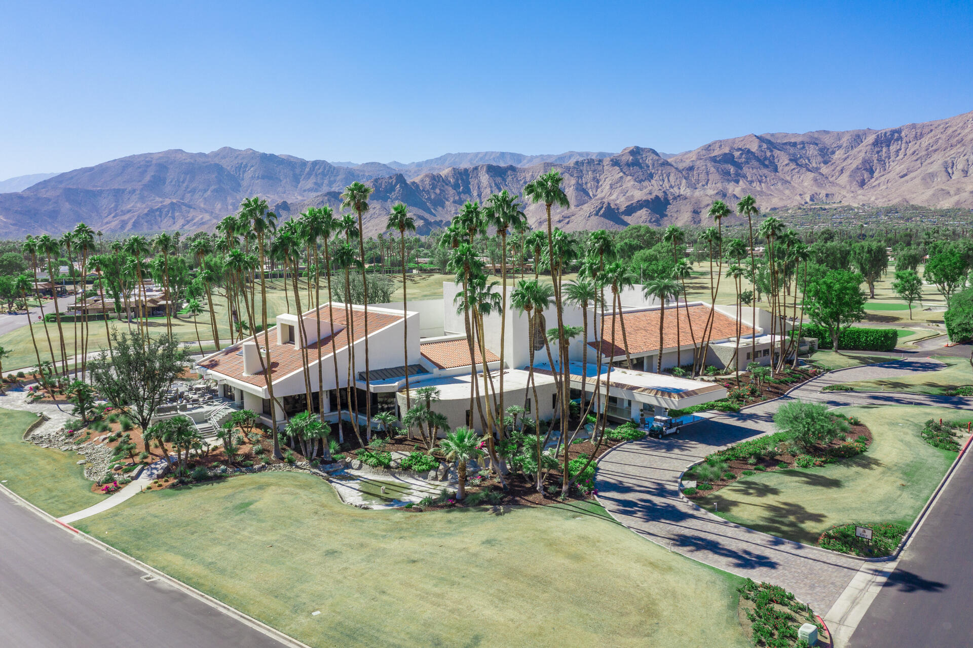 49 Columbia Drive Rancho Mirage, CA 92270 - Photo 41 of 52 a view of a house with a mountain and a lake view