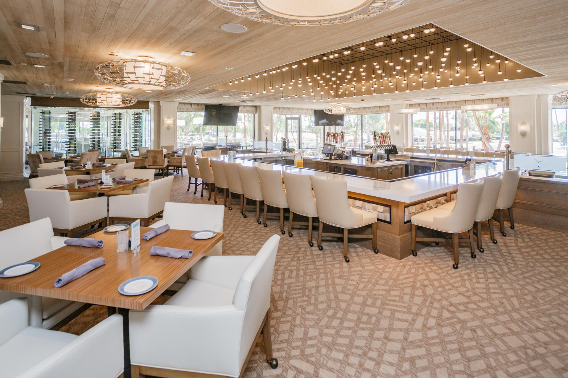 49 Columbia Drive Rancho Mirage, CA 92270 - Photo 43 of 52 a dining room with lots of furniture and a chandelier
