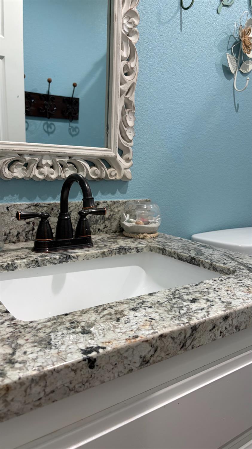 3105 Keller Street Modesto, CA 95355 - Photo 12 of 25 a view of a sink and a granite counter top