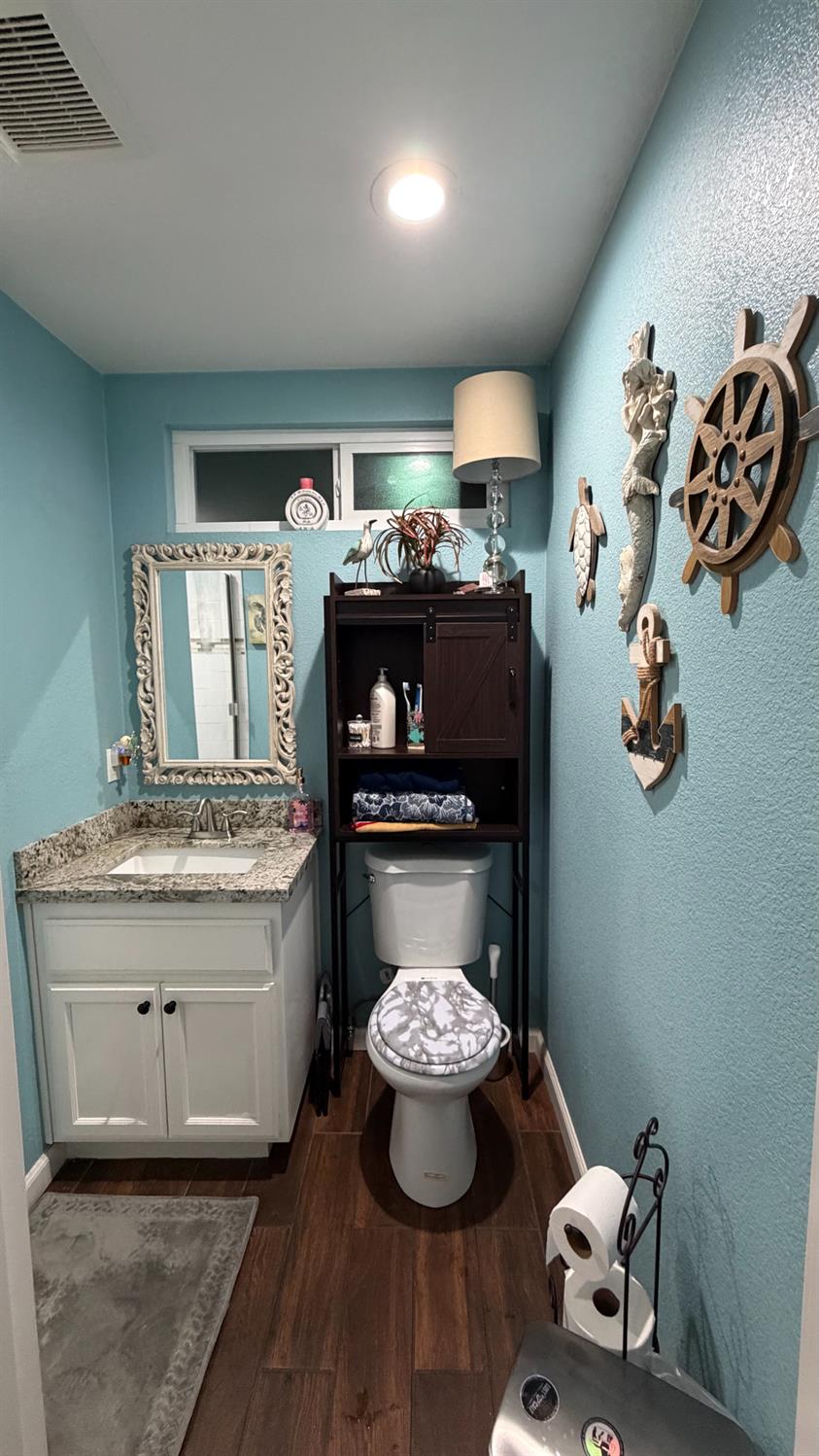 3105 Keller Street Modesto, CA 95355 - Photo 15 of 25 a room with a fireplace and chandelier