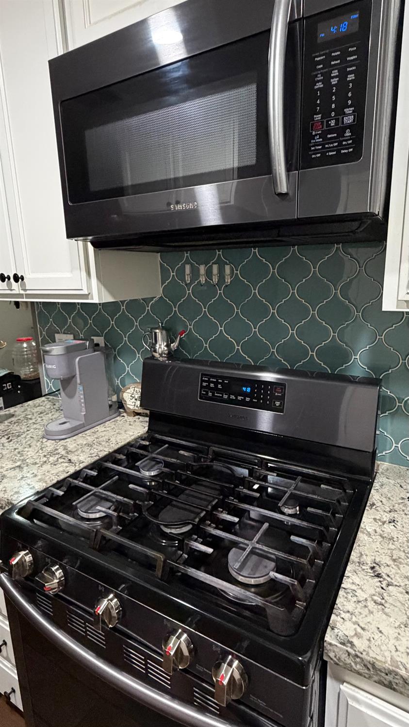 3105 Keller Street Modesto, CA 95355 - Photo 5 of 25 a stove sitting inside of a kitchen