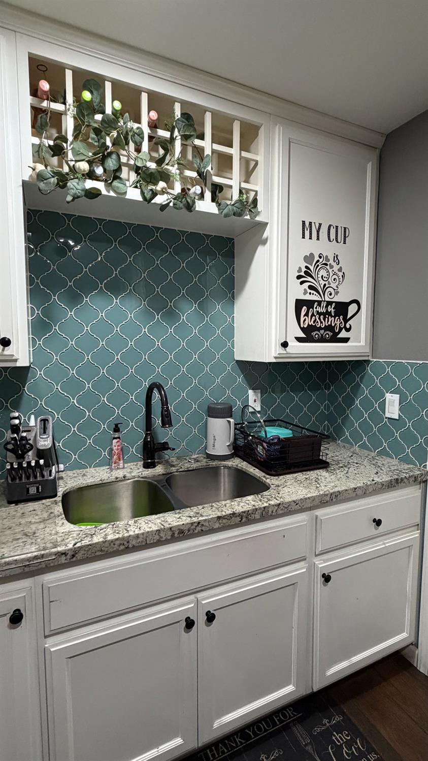 3105 Keller Street Modesto, CA 95355 - Photo 6 of 25 a kitchen with sink and cabinets
