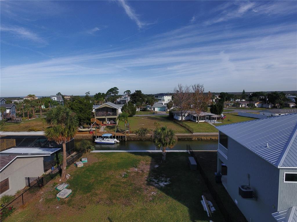 4977 Cedarbrook Lane Hernando Beach, FL 34607 - Photo 15 of 25 an aerial view of a house with a yard