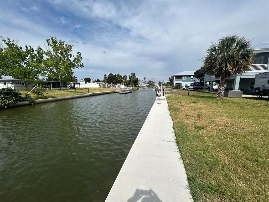 4977 Cedarbrook Lane Hernando Beach, FL 34607 - Photo 21 of 25 a view of a lake with houses